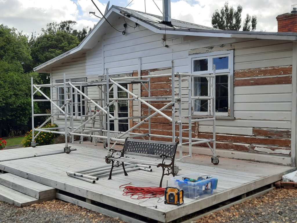 Scaffolding up as preparation and priming gets underway on the exterior of this old villa