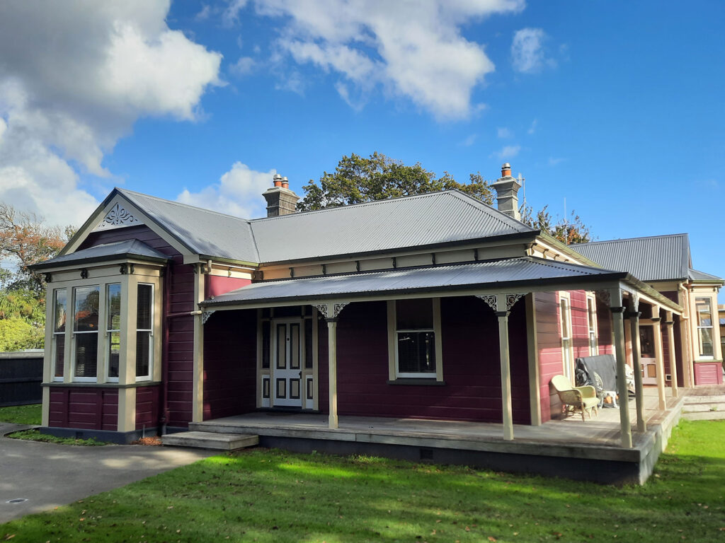 The exterior painting of this home was inspired by the colourful villas of San Francisco this old home was transformed with a colour pallet of Resene Mulberry, Kelp and Half Canterbury Clay