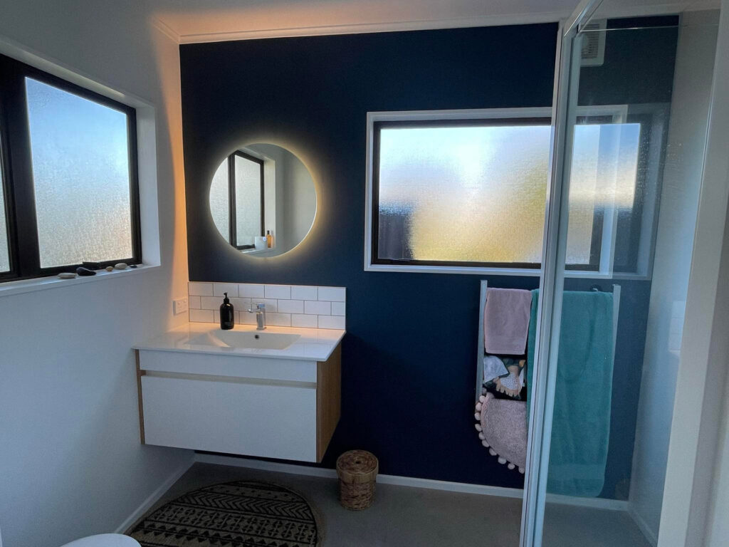 Moody blue bathroom renovation by the quality painters at Swish Decorating