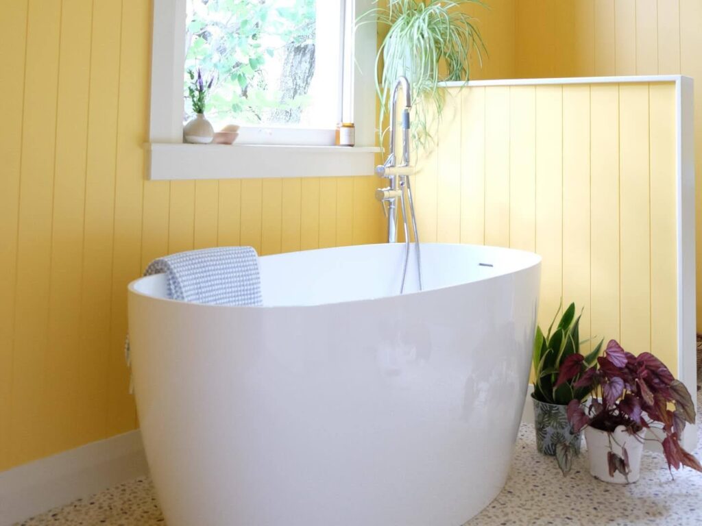 Bathroom painted in Resene yellow Cream Can