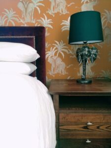 Gold embossed, elephant wallpaper, professionally hung by Swish Decorating