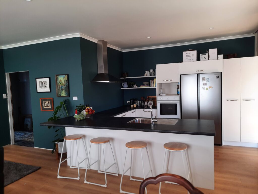 The interior painting of the lounge walls in the soft grey green Resene Green Meets Blue by the team at Swish Decorating