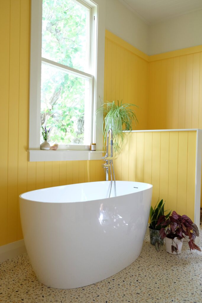 Vibrant bathroom makeover with walls in Resene Cream Can