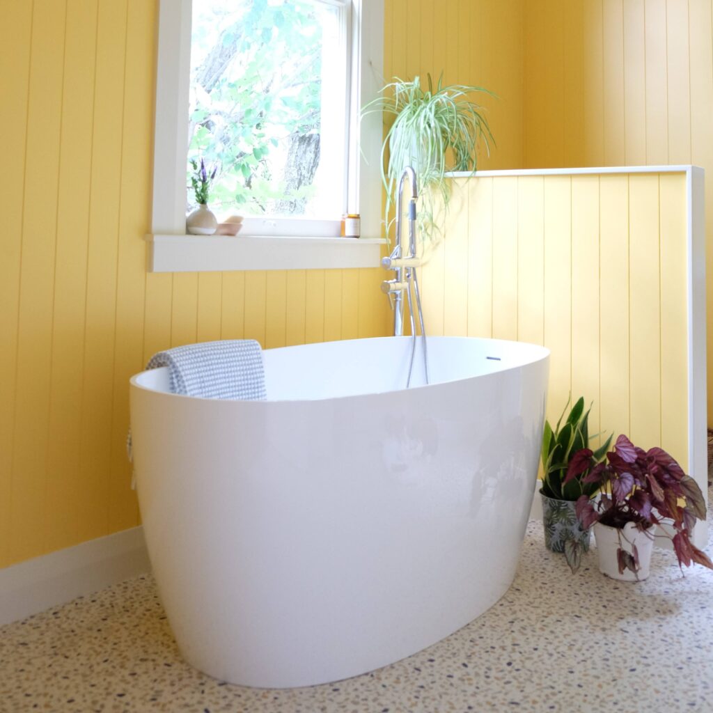 Vibrant bathroom makeover with walls in Resene Cream Can