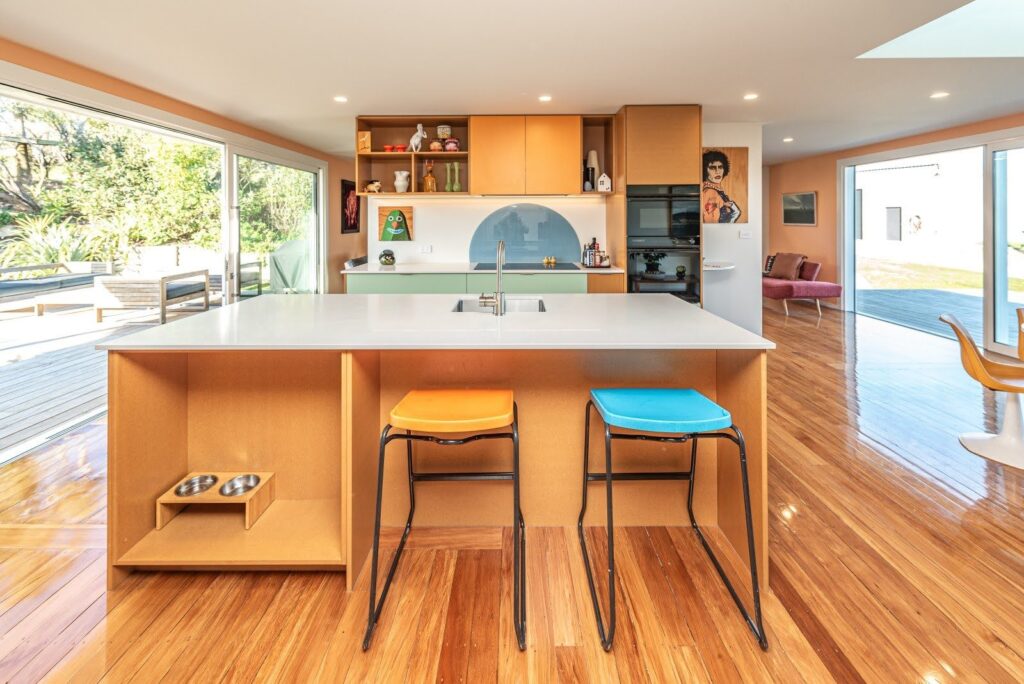 A bold retro inspired renovation project with main walls painted in Dulux Remuera and feature walls in Dulux Fuzzy Peach & Long Island