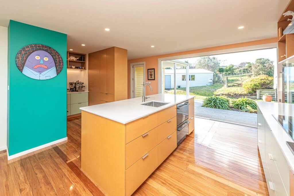 A bold retro inspired renovation project with feature walls in Dulux Fuzzy Peach & Long Island