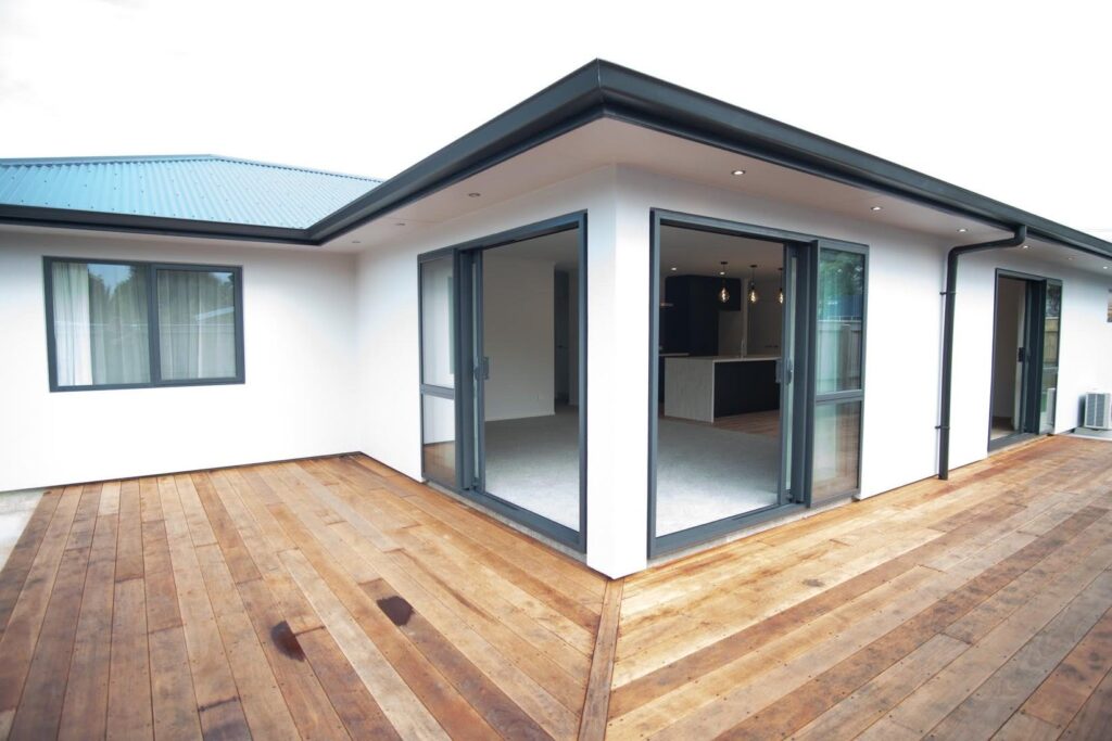 New build exterior spray finished in Resene Black White to perfectly offset the aluminium joinery