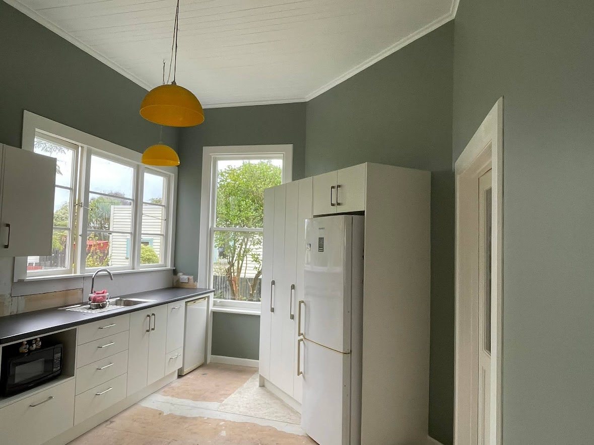 Kitchen and Dining room painted in the lichen green of Karen Walker Windblown Green from Resene