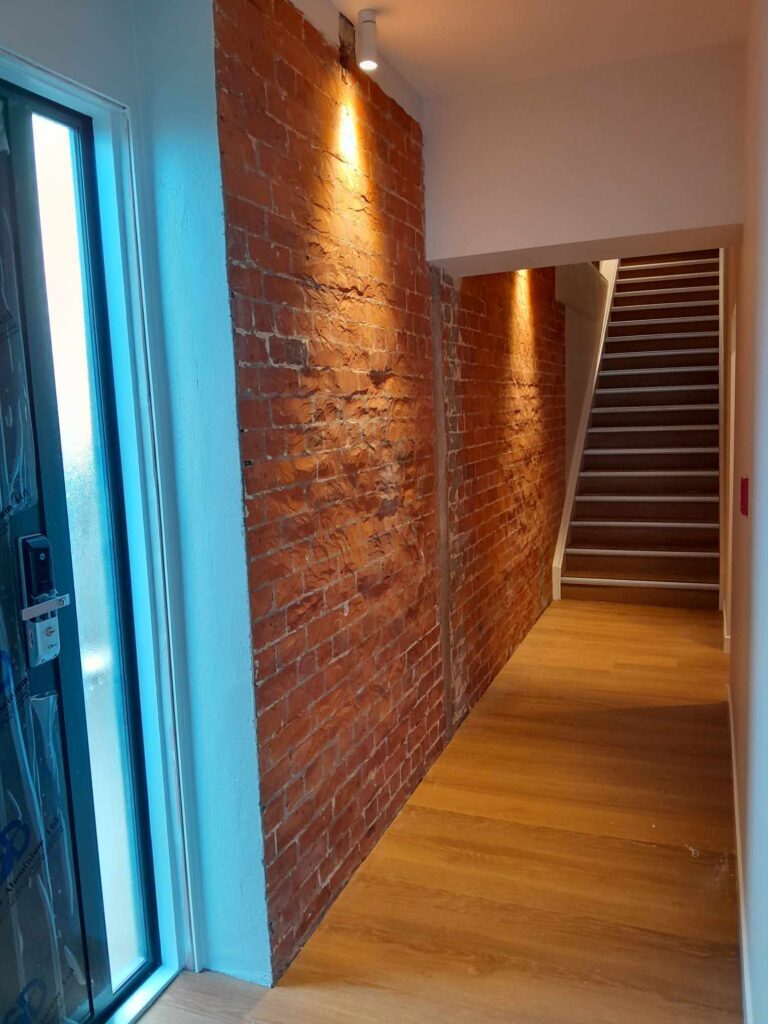 Restoration and conversion of the 1914 Johnston & Co building into apartments and office spaces with interior painting by the Swish Decorating team of quality painters