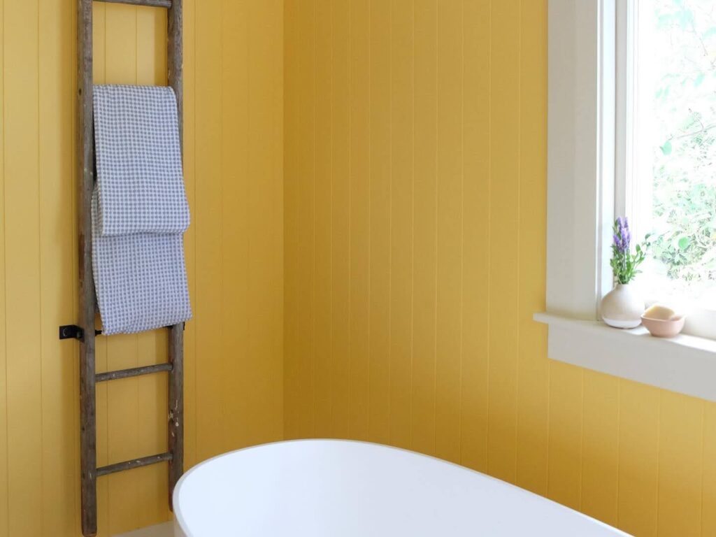 Vibrant bathroom makeover with walls in Resene Cream Can