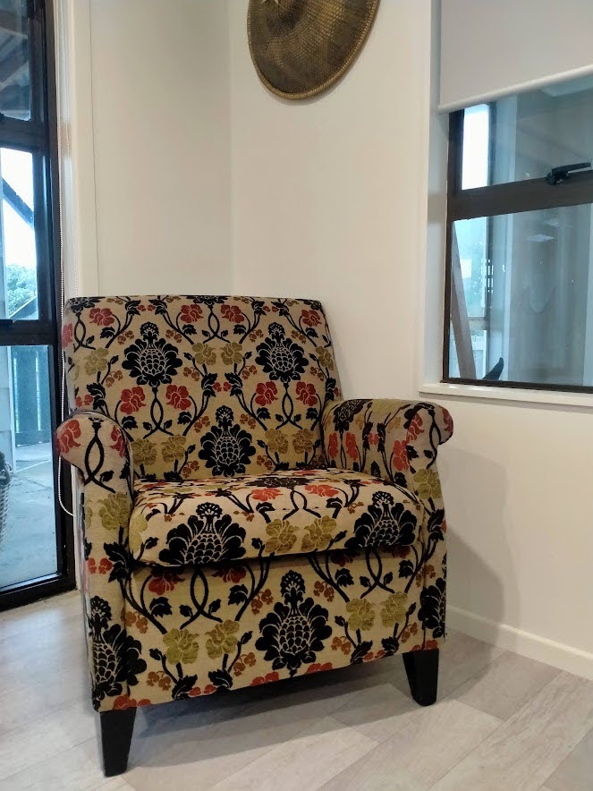 Spray finished interior walls in Resene Sea Fog complement this statement armchair in this large renovation project.