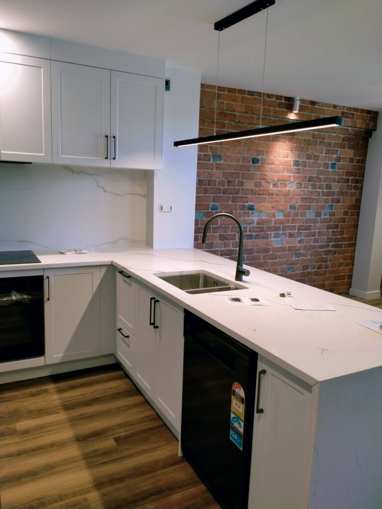 Restoration and conversion of the 1914 Johnston & Co building into apartments and office spaces with interior painting by the Swish Decorating team of quality painters