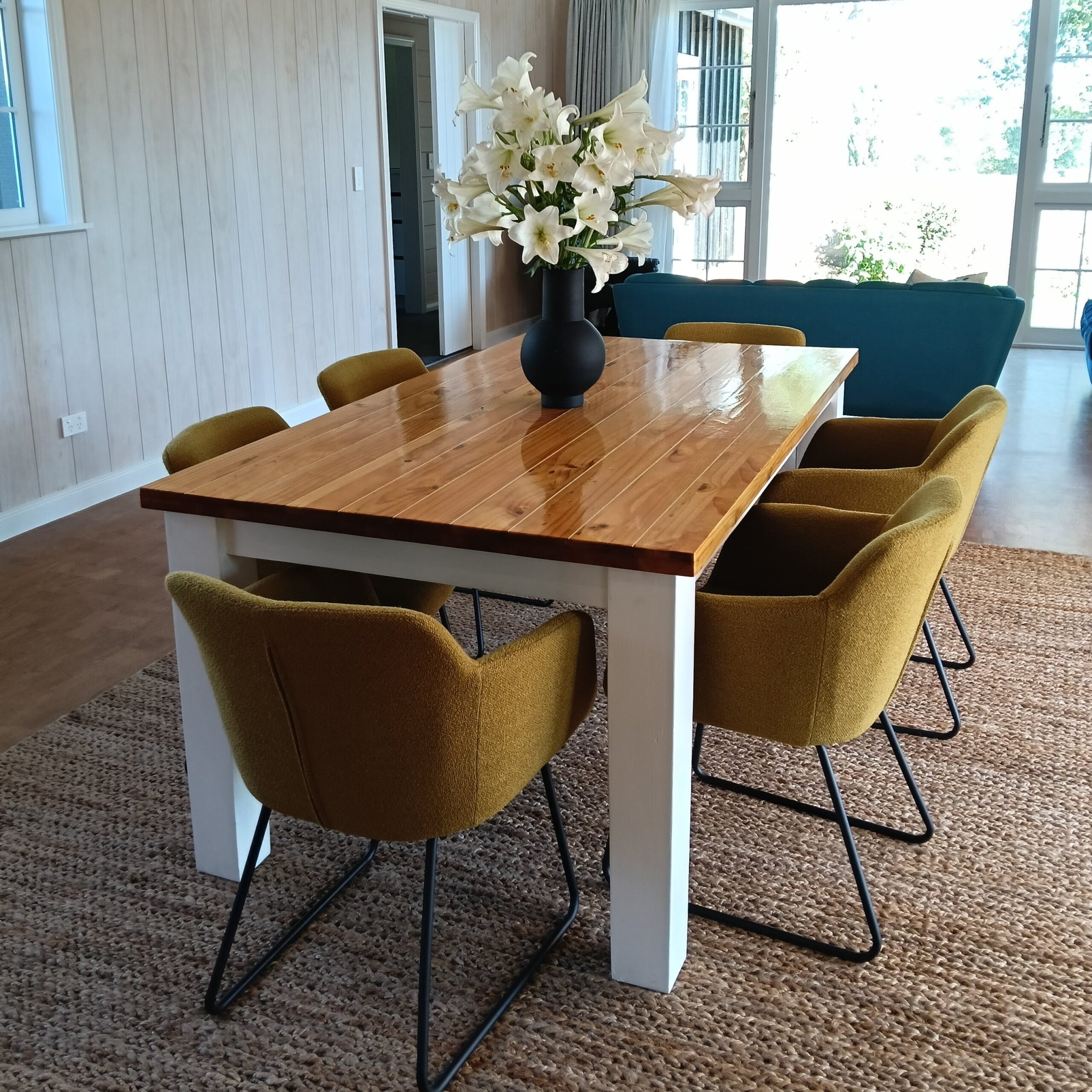 Complete interior renovation for these clients with a beautiful airy open plan living area featuring walls whitewashed in Resene Greywash, ceiling beams in Indian Ink and ceiling in Black White