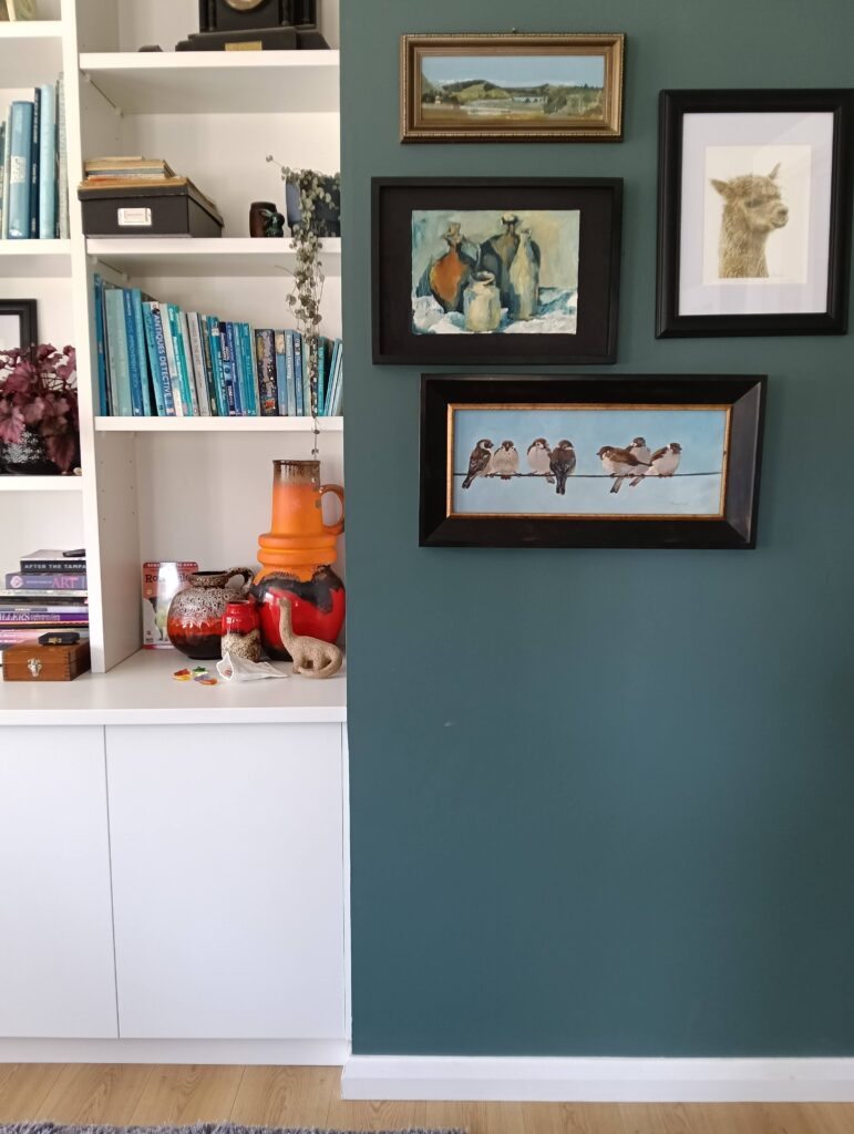 The soft grey green of Resene Green meets Blue creates a sense of drama in this open plan living space