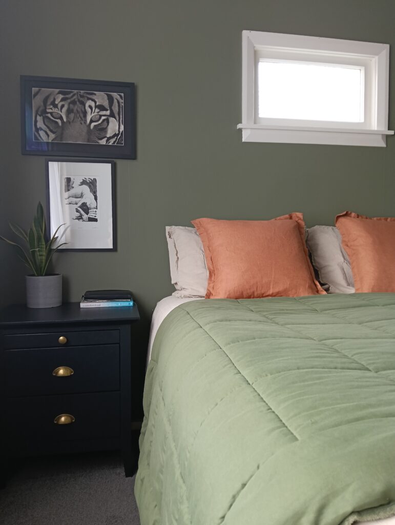 A calm and relaxing master bedroom with walls painted in the exotic green of Resene Siam