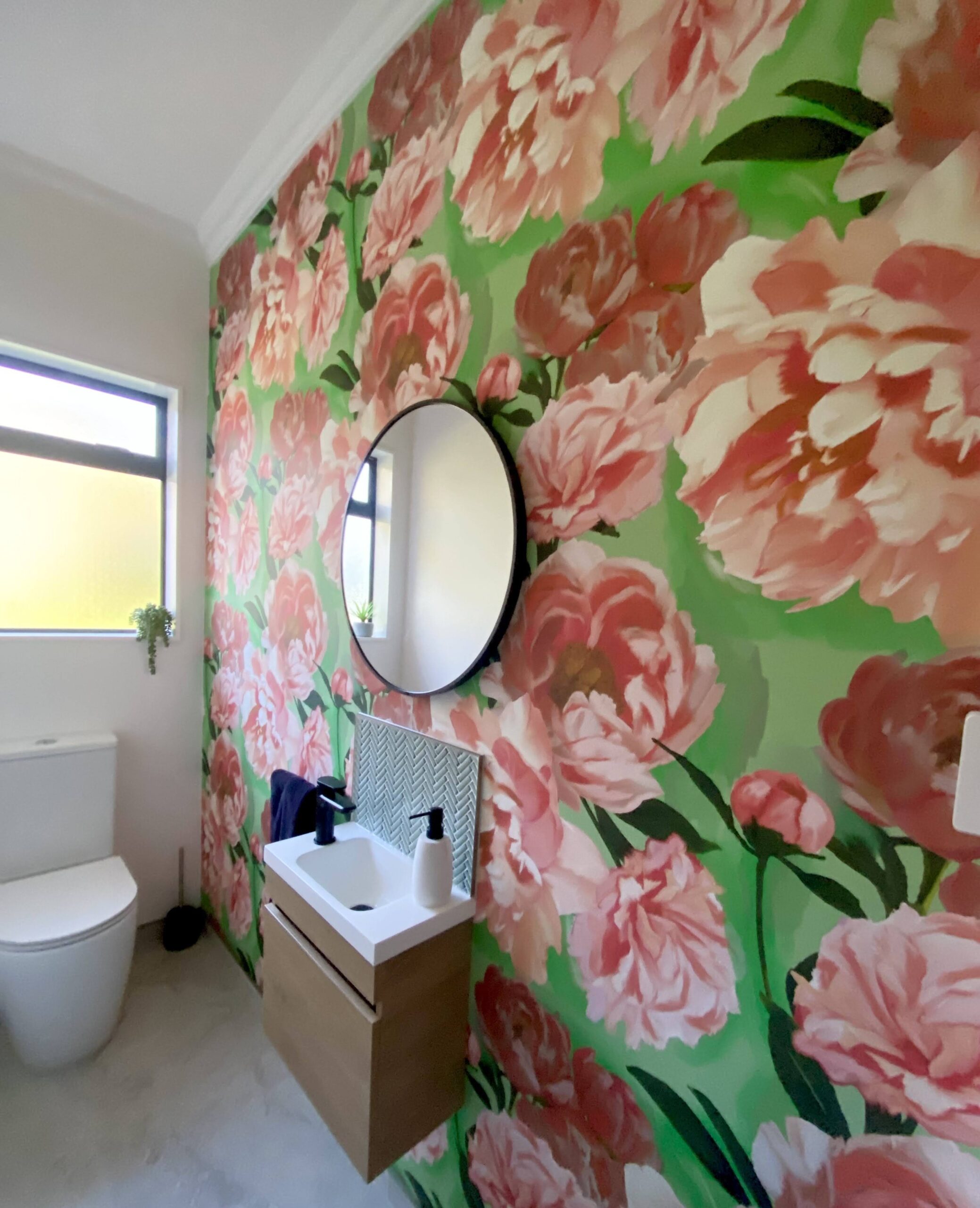 Floral feature wallpaper hung by Swish Decorating in a client's bathroom