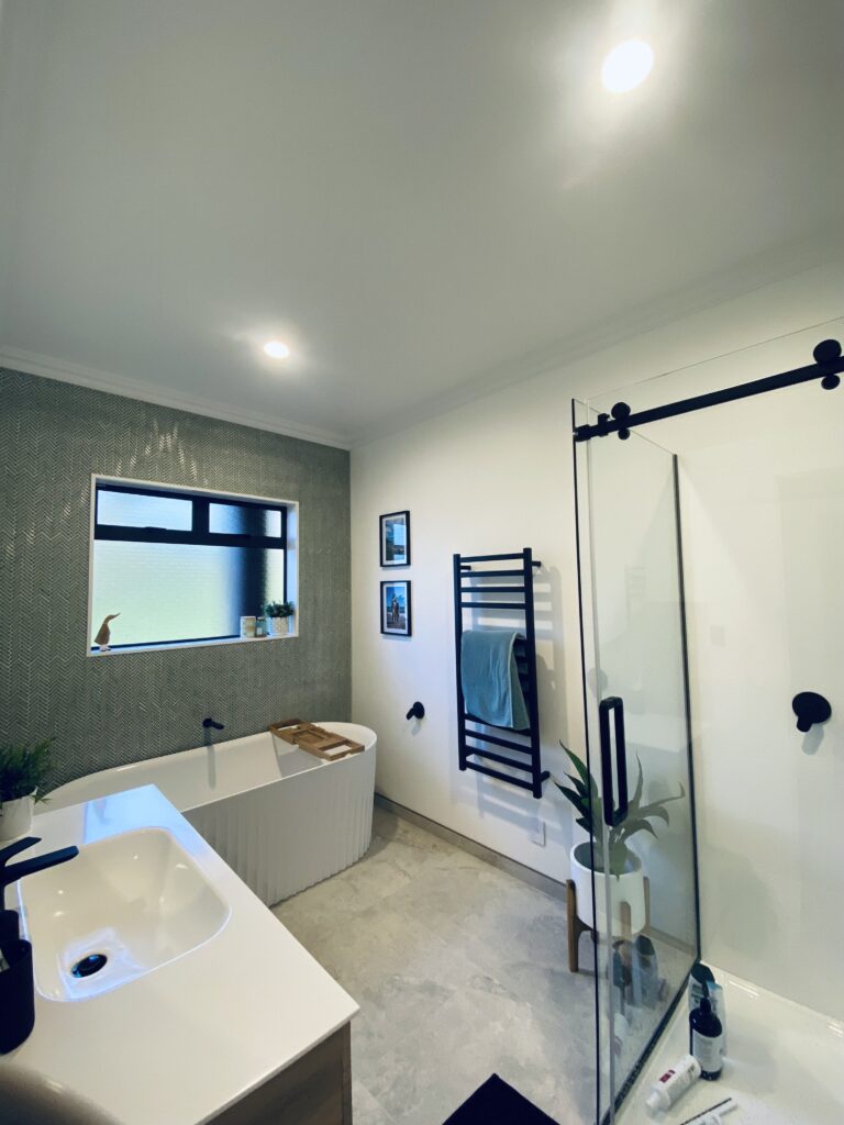 A clean, fresh and modern finish to this bathroom with walls painted in Resene Alabaster by the quality painters and decorators at Swish Decorating
