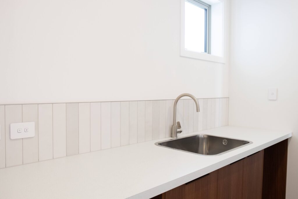 The laundry in this rural new build is calming and understated.