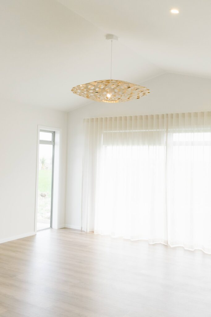 A David Trubridge light hangs in the dining room of this rural new build
