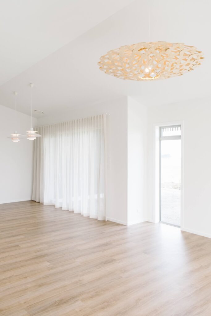 A David Trubridge light hangs in the dining room of this rural new build
