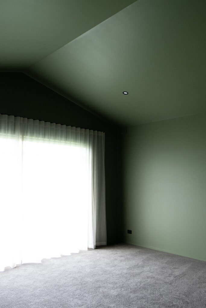 The media room has been colour drenched in Resene Siam, creating a cosy space to curl up and watch a movie.